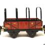16630_maerklin_gueterwagen_2_achsig_rotbraun_mit_planengestell.jpg
